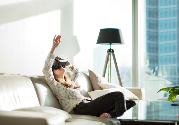Woman undergoing virtual reality therapy treatment in the comfort of her own home