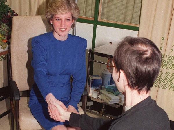 Princess Diana shakes hands with an AIDS patient in London, 1987.
