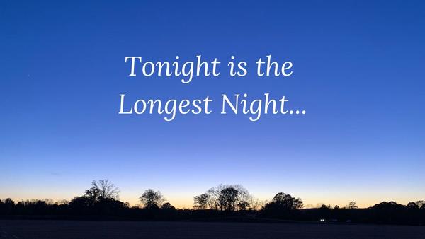 Green garland framing text, four candles 