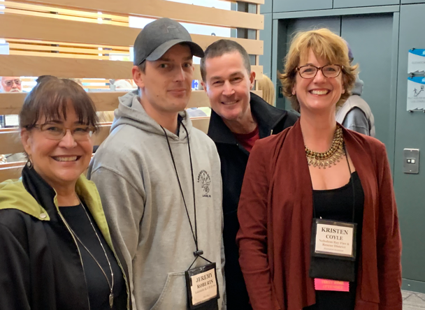 A group of people posing for a photo
                                                
                                                Description automatically generated