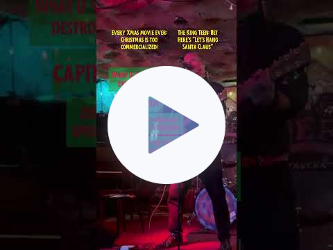 Video of an incredibly handsome man singing and playing guitar in a nightclub