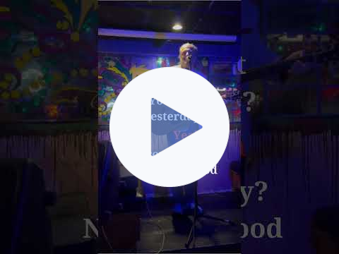 YouTube video short of me onstage at Zog's, holding a guitar and talking. Click to play it at YouTube