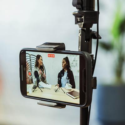 image of smartphone recording an interview with two women