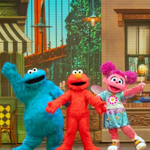 Cookie, Elmo, & Abby pose on Sesame Stree