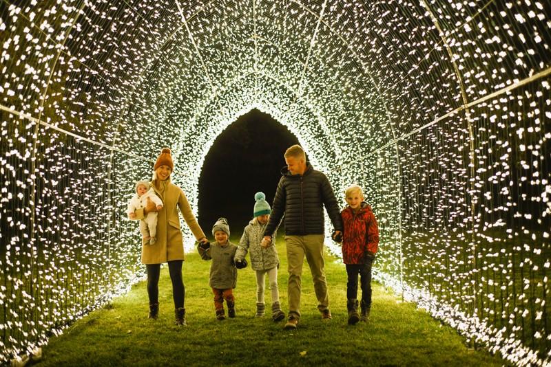 Lightwalk family in light tunnel