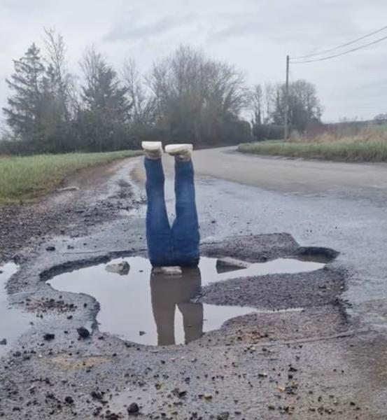 Caution: pothole.