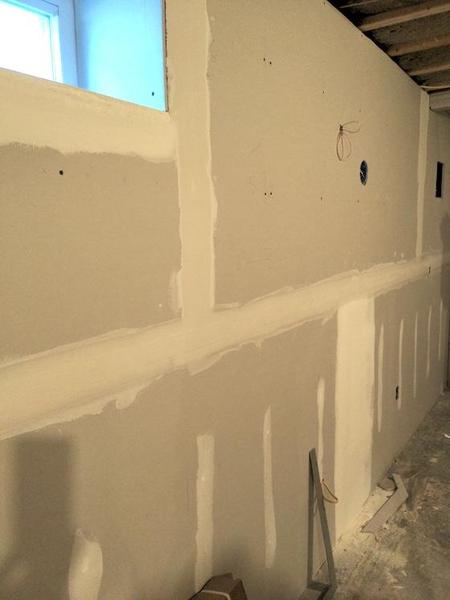 taped drywall in a basement
