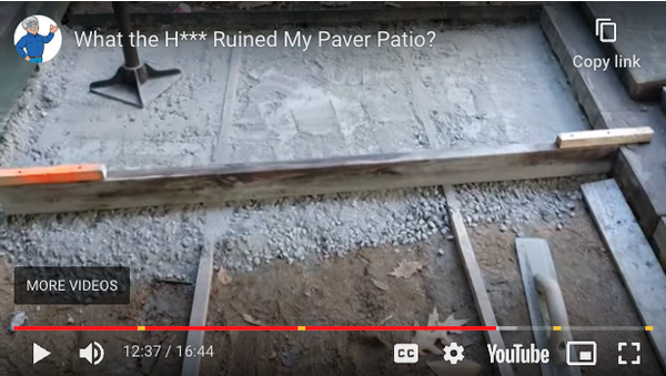 dry concrete mix being screeded