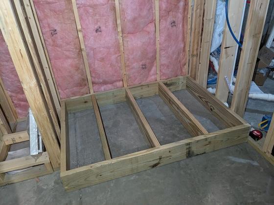 treated lumber platform for son's shower