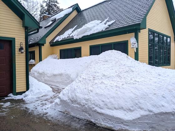 snow pile next to house