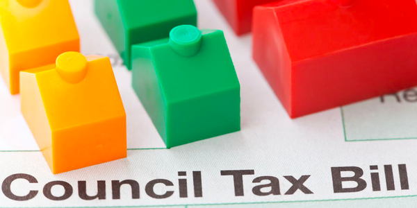 Plastic buildings on top of a Council Tax bill