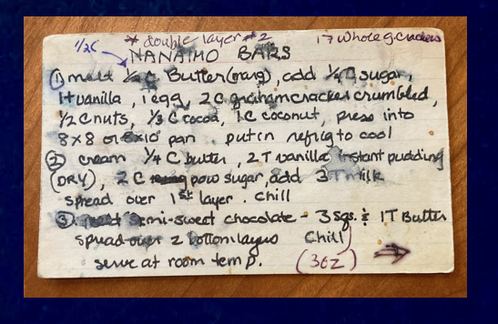 (Photo of very worn, messy, water-stained 3x5 index card with Nanaimo bars recipe written on it in black flair pen)