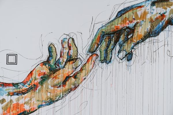 A watercolour of painted hands nearly touching