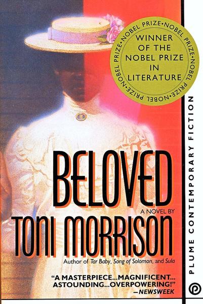 Book cover of Beloved by Toni Morrison. The cover shows a faded, ghostly image of a woman in a white lace dress and wide-brimmed hat decorated with flowers. Her face is partly obscured by shadow and red light. A large gold circle at the top right reads “Winner of the Nobel Prize in
Literature.” The author’s name, Toni Morrison, appears in bold black letters beneath the title. At the bottom is a review quote from Newsweek: “A masterpiece… magnificent… astounding… overpowering!” The spine notes “Plume Contemporary Fiction.”
