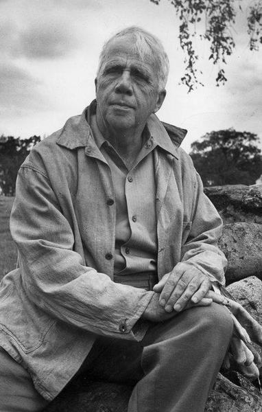 Portrait of Robert Frost seated outdoors