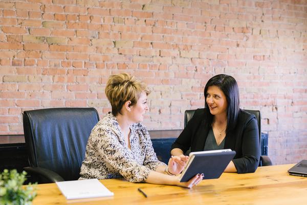 Two business women at a table