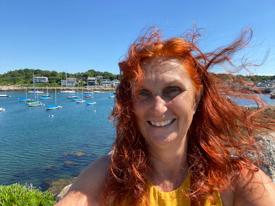 Heidi Straube photographer on a joyful day at the cliffs and sea of Rockport Massachusetts