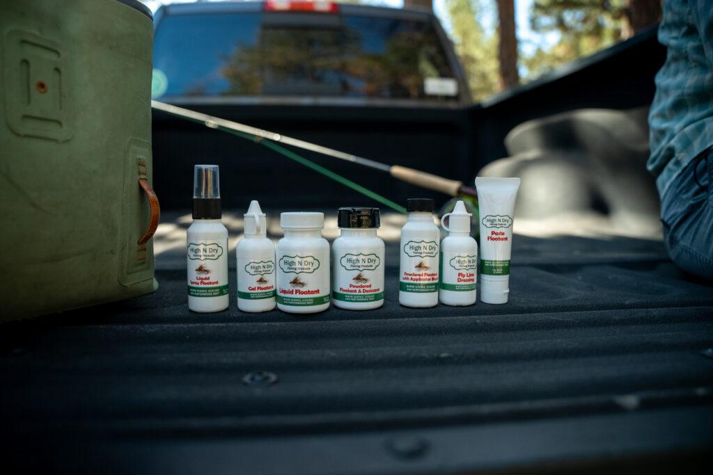 A group of bottles on the back of a truck
            
            Description automatically generated