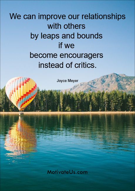 hot air balloon going over a lake