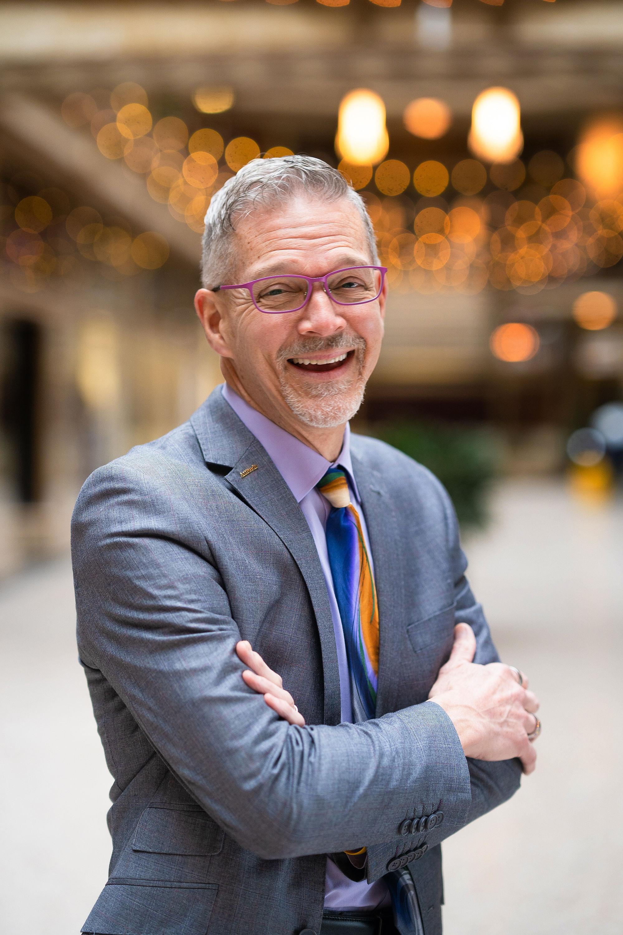 Author sitting on concrete wall