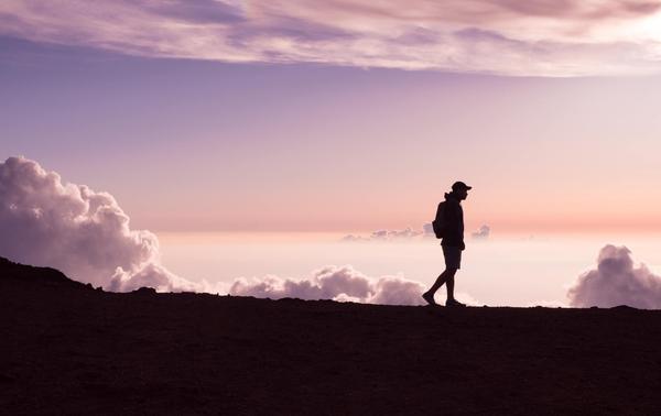 A silhouette of a person walking