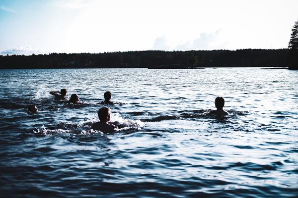 People swimming in a lake