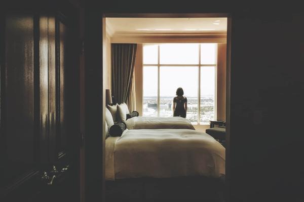 A person looking out a window