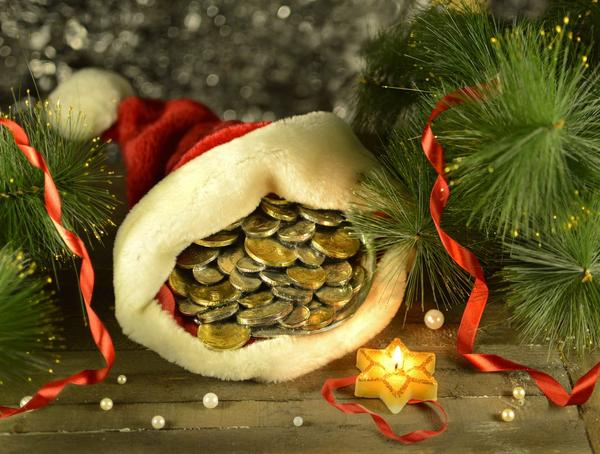 A Christmas hat filled with coins