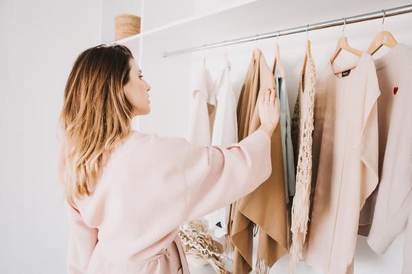 A woman looking in a wardrobe