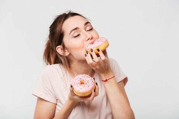 A woman eating donuts