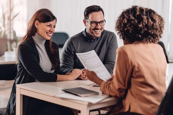 Couple speaking to an adviser.