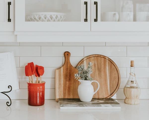 A kitchen counter with utensils on it
