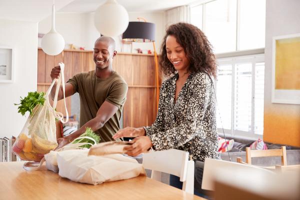 a couple with bags of food