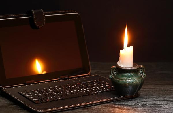 a candle and a laptop