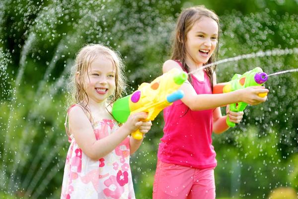 children playing with water guns