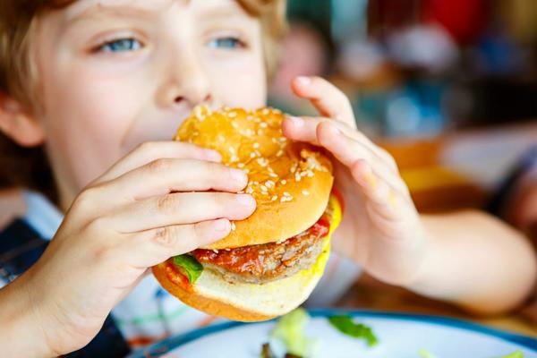 A child eating a burger