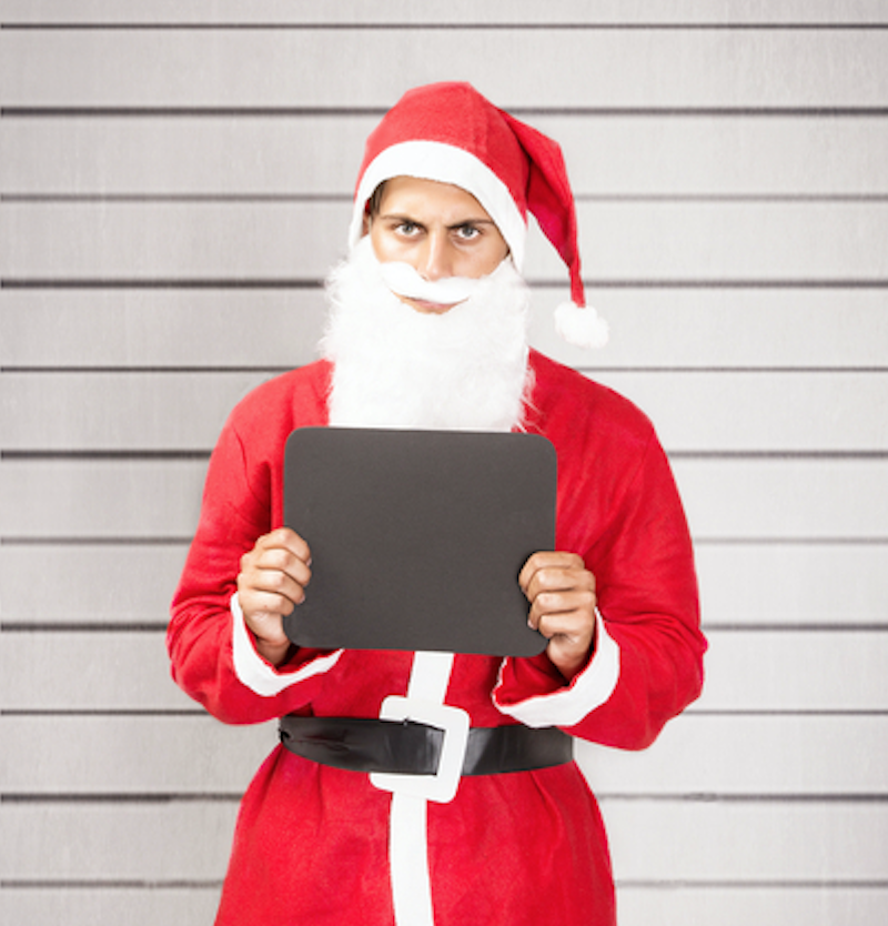 a mugshot of man dressed as santa 