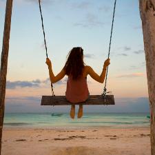 woman on a beach swing
