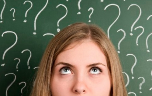 a woman with question marks above her head