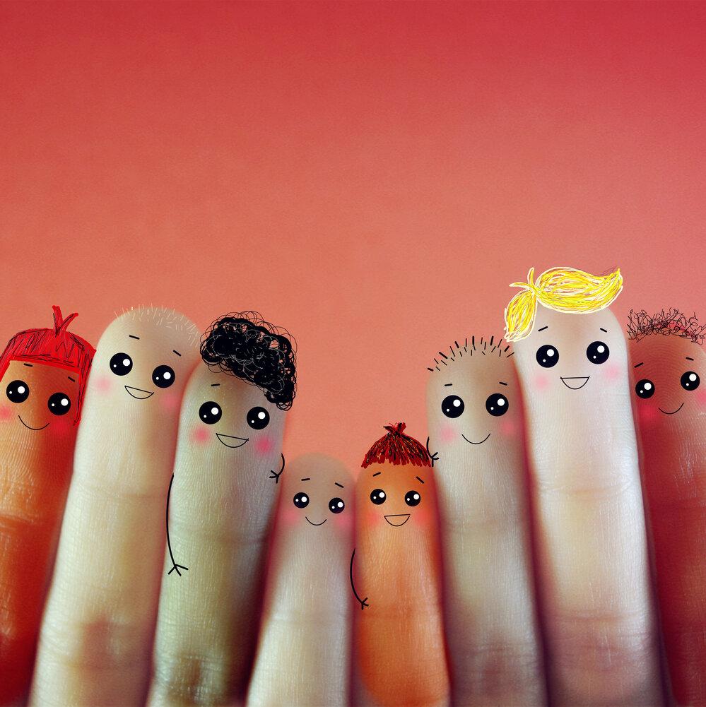 Fingers with faces for different ages
