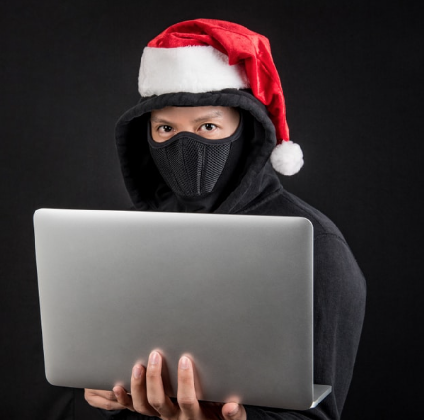 scammer with a christmas hat