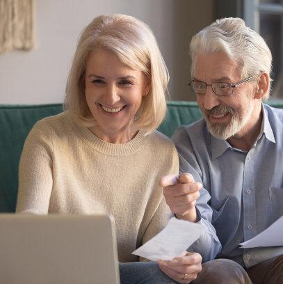 An older couple on a laptop