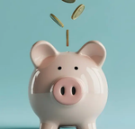 coins falling into a piggy bank
