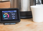 A smart meter next to a kettle