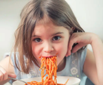 girl eating spaghetti