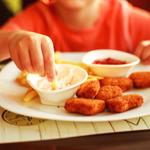 A child eats at a restaurant