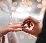 Wedding couple exchanging rings