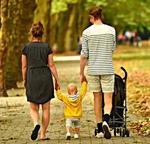 family walking through a park
