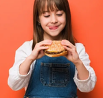 Girl holding a hamburger