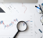 magnifying glass on stock chart